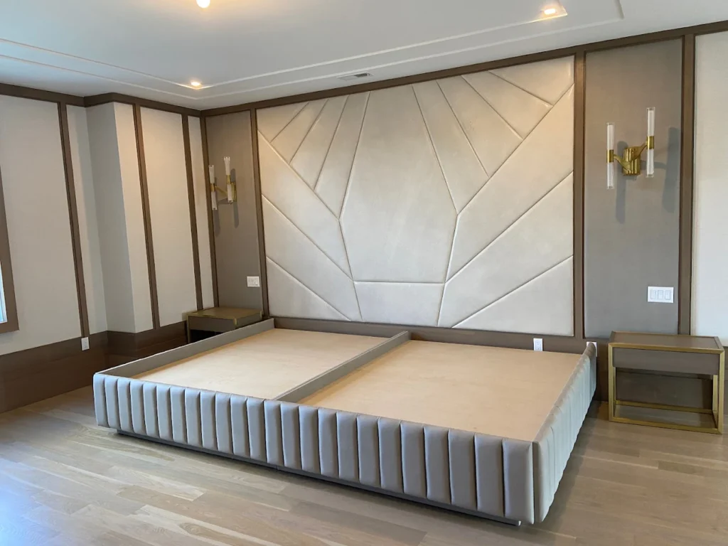 Leather upholstered headboard with wall panels and wood trim