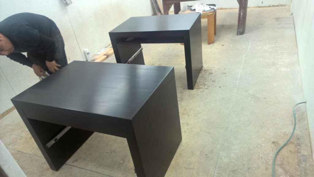 Barbara Barry for Baker bedside table fully stripped down in the refinishing room before restoration for the Baker showroom.