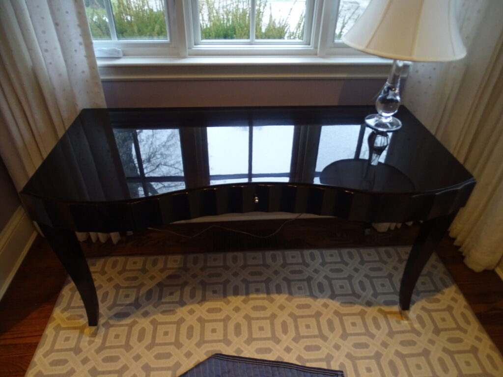 High‑gloss detail of a restored Barbara Barry for Baker dressing table photographed in the client’s NYC home.