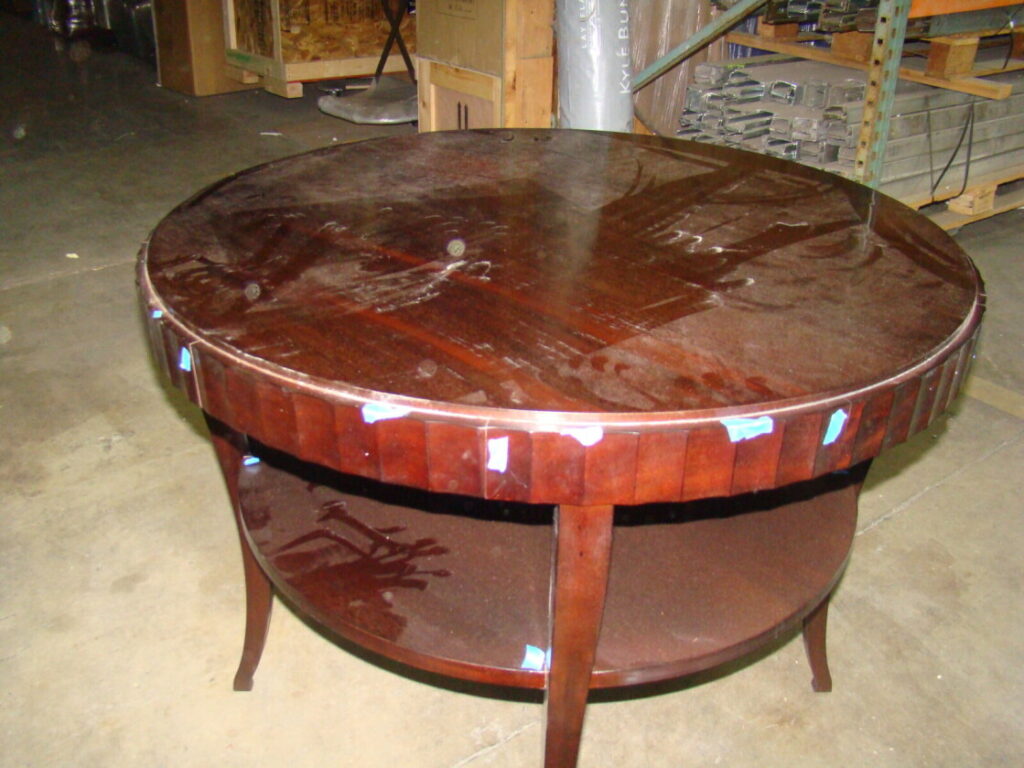 Barbara Barry for Baker fluted edge entry table photographed in damaged condition before restoration.