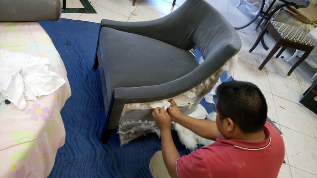 Barbara Barry for Baker Piedmont lounge chair in the workshop during the reupholstery process.