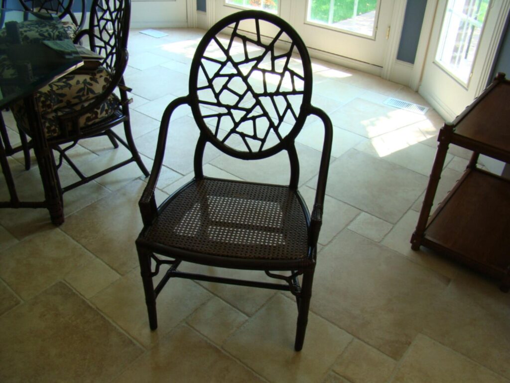 Wooden dining chair fully repaired and reassembled after on‑site service.