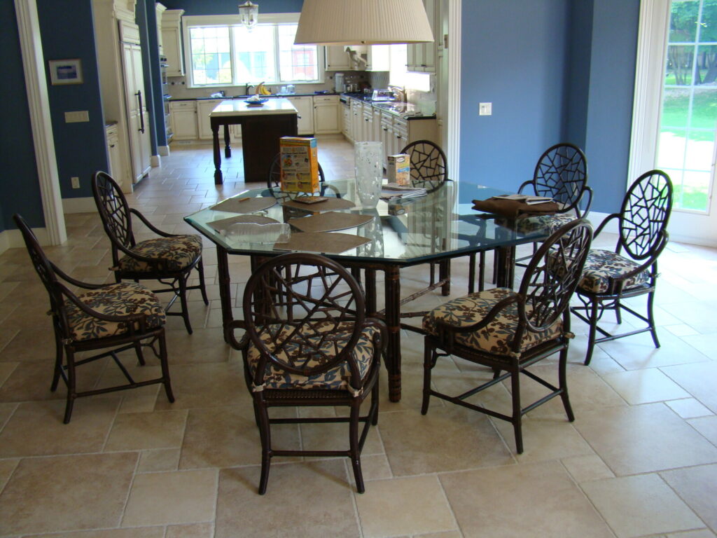 Complete dining set arranged in a bright room after all chairs were repaired.