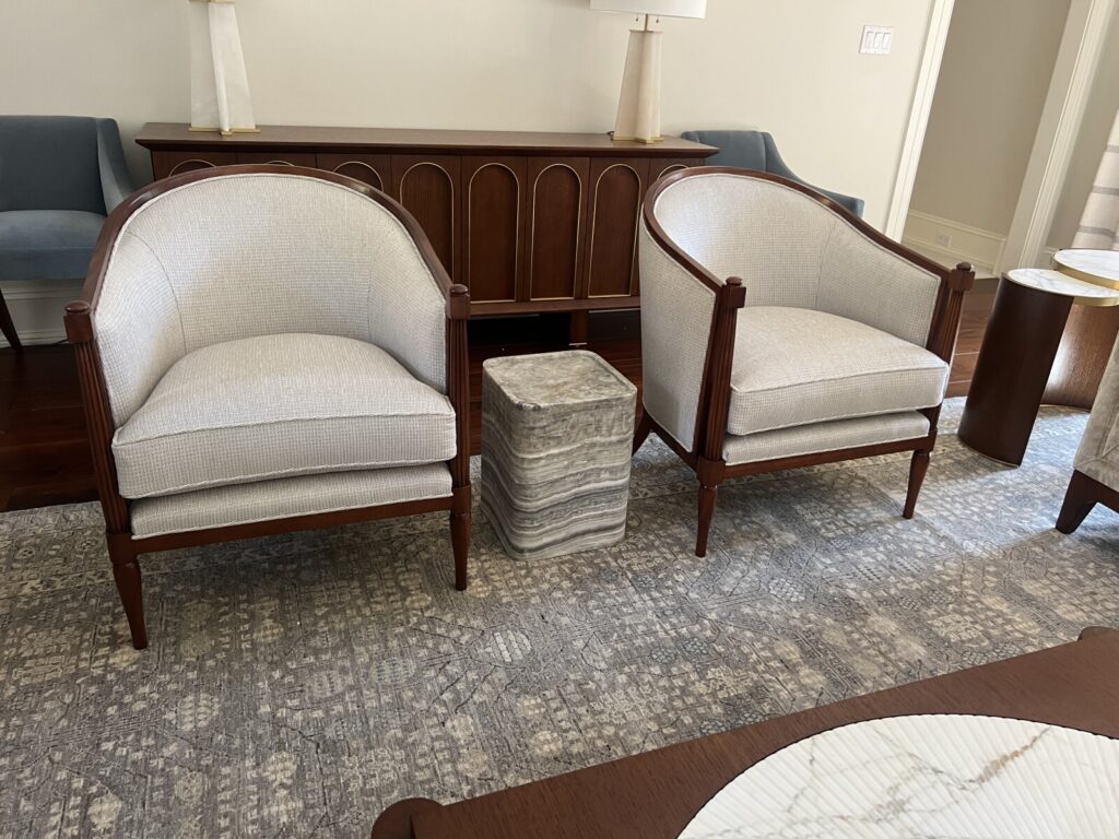 Lounge chair reupholstered and shown after delivery in a finished interior.