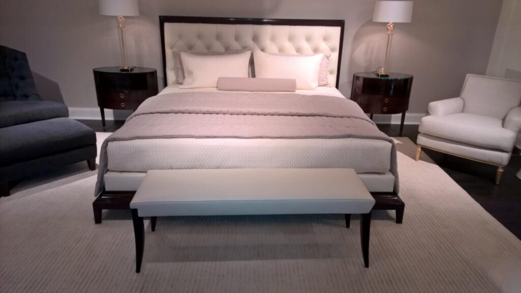 Restored Baker Thomas Pheasant Moderne headboard with repaired structure and refreshed finish, shown in the Baker showroom.