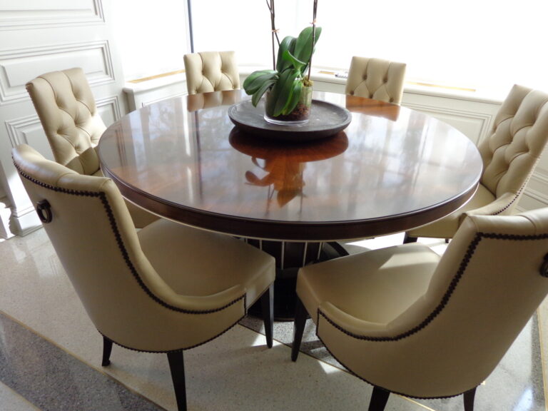Baker ritz chairs and dining table with leather tufted upholstery and refinishing after delivery.