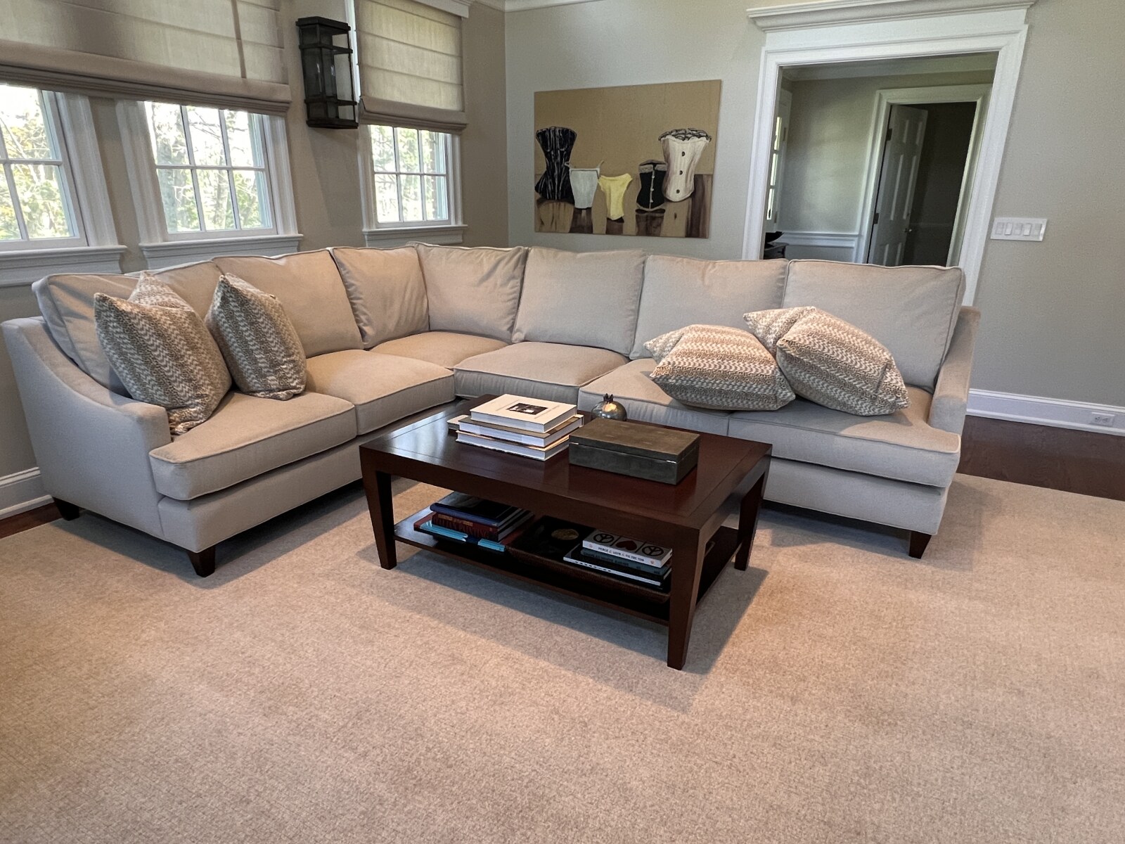 Custom velvet upholstered sectional sofa displayed in the client’s home.