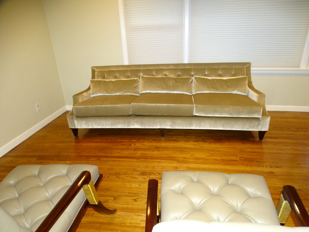 Restored Baker Thomas Pheasant Max sofa featuring a sophisticated diamond-tufted back, sleek bench-style seat cushion, and elegant tapered wood legs in a velvet finish.