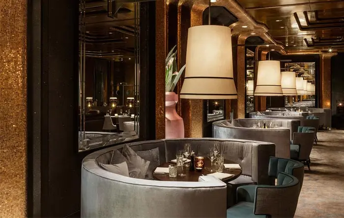 Custom upholstered restaurant booths installed in a commercial dining space, showing the finished seating layout.