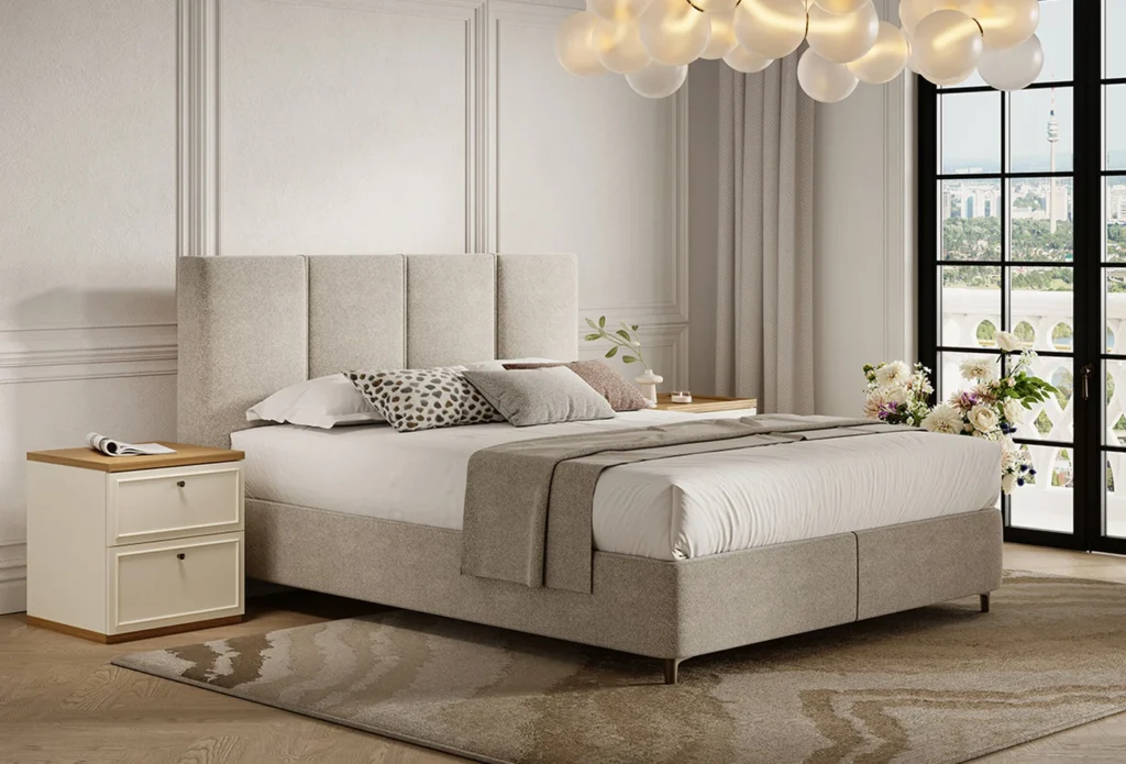 Modern bedroom with a tall upholstered headboard, white bedding, matching nightstands, and a bubble‑style chandelier.