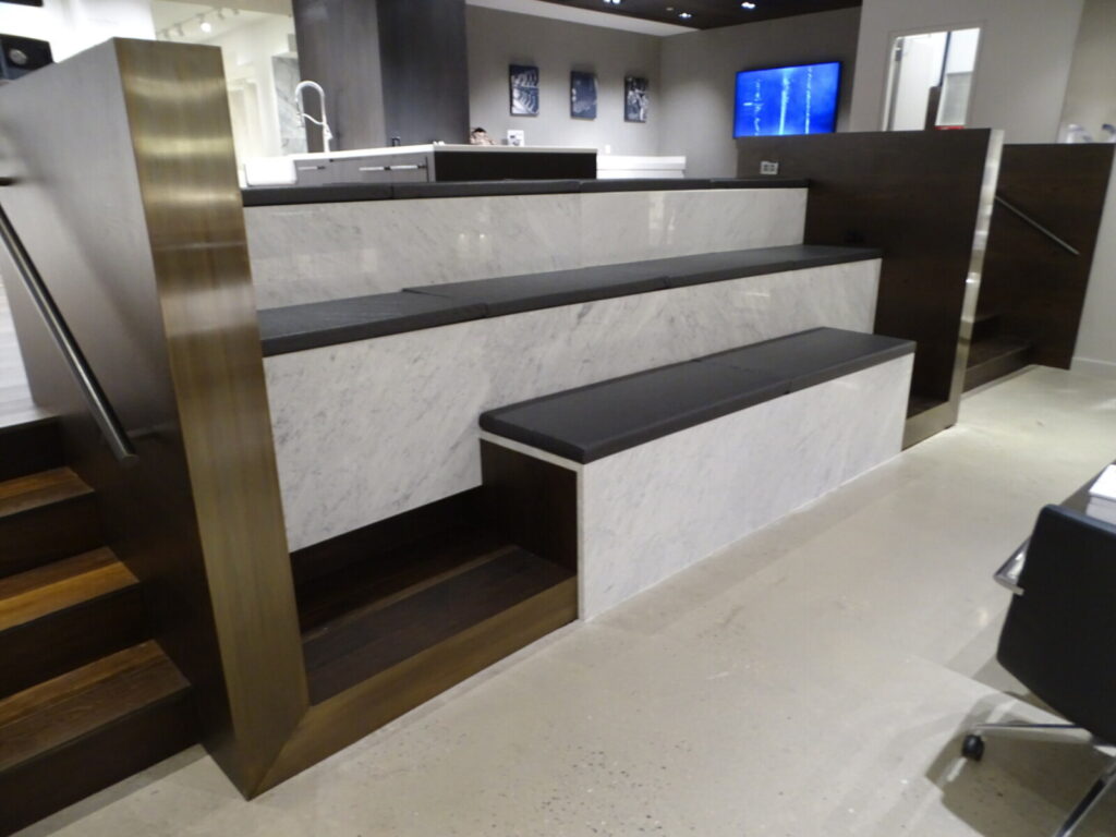 Completed banquette with soft upholstery and wood trim in a retail café.