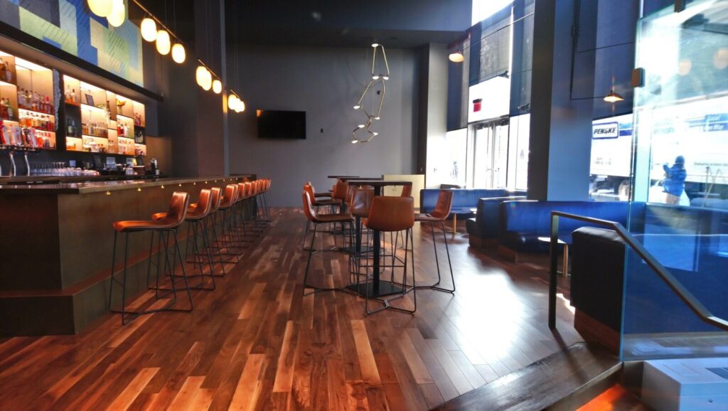 U-shaped banquette in a theater room during final installation steps.