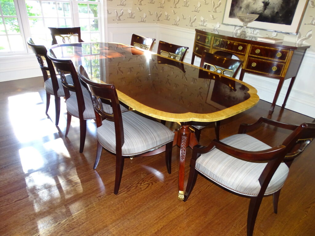 Baker banded mahogany dining table restored with detailed refinishing in New Jersey.