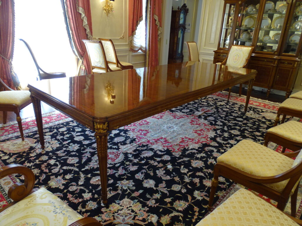 Baker Louis XVI dining table restored with gold leaf accents and refinished details