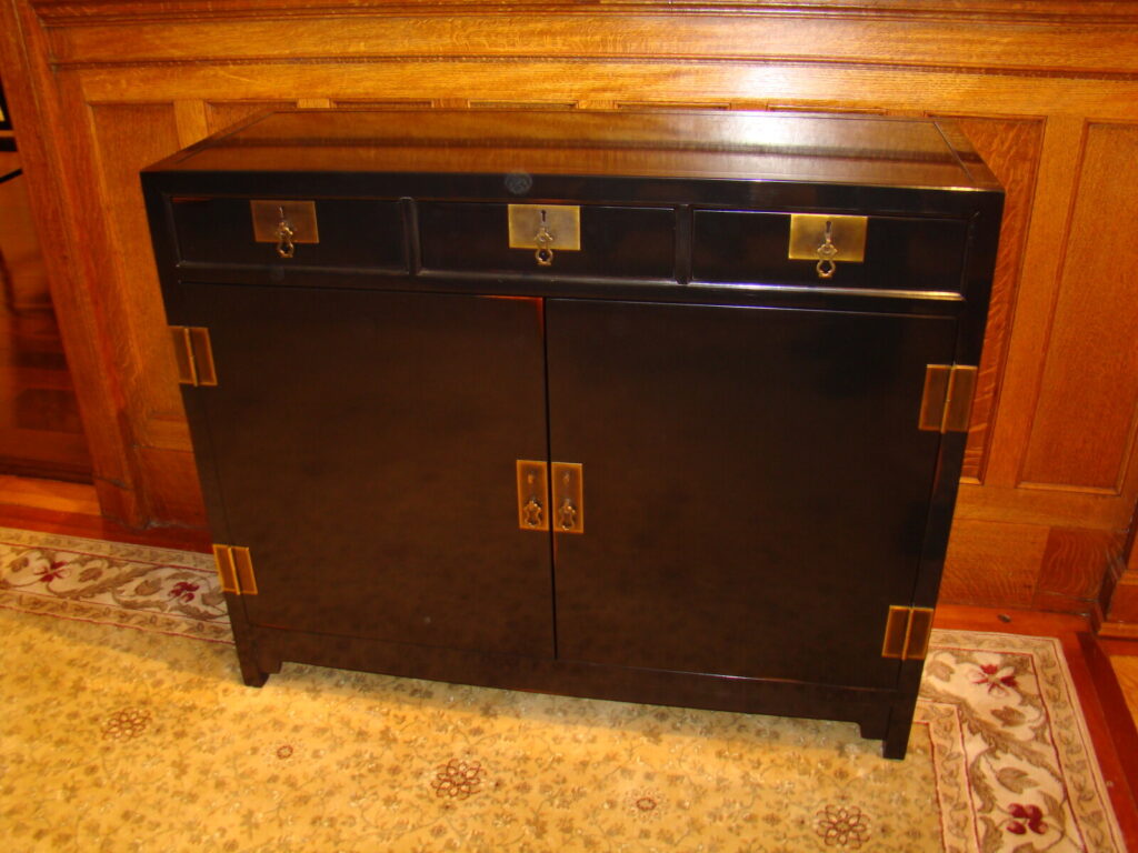Baker black lacquer chinoiserie chest restored with brass hardware and detailed refinishing.