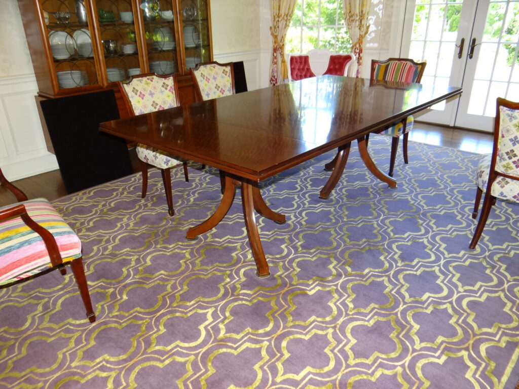 Restored Baker Reserve Thomas Pheasant Vienna dining table photographed in the client’s home after delivery.