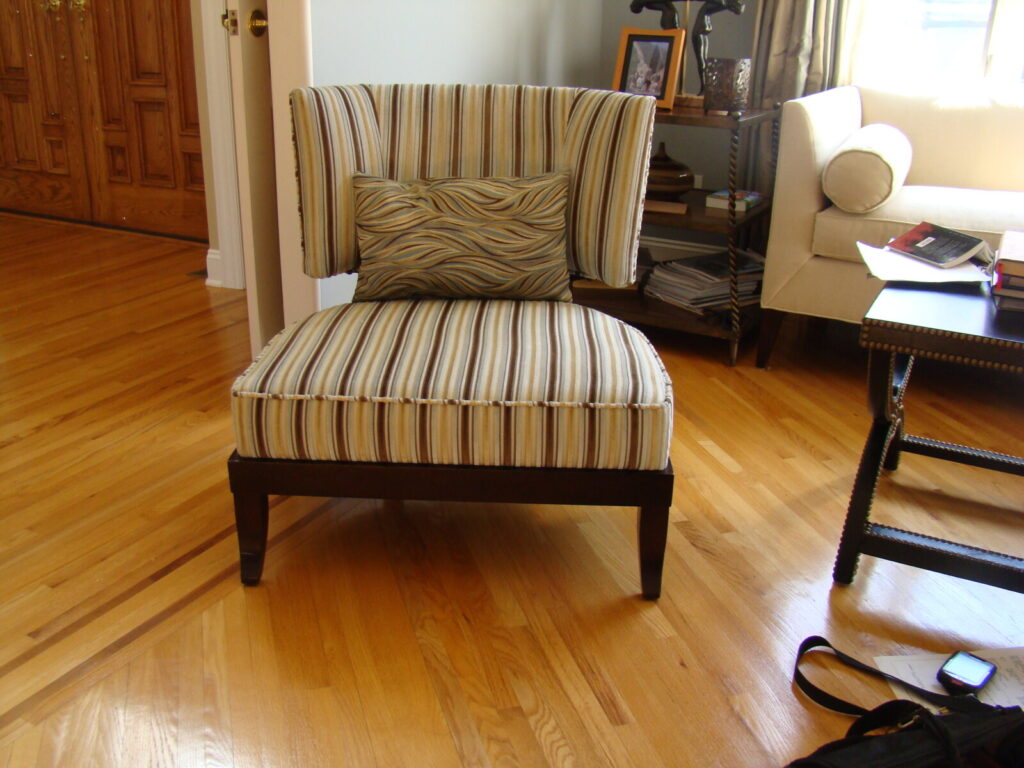 Single accent chair refinished and reupholstered, shown after completion in a finished interior.
