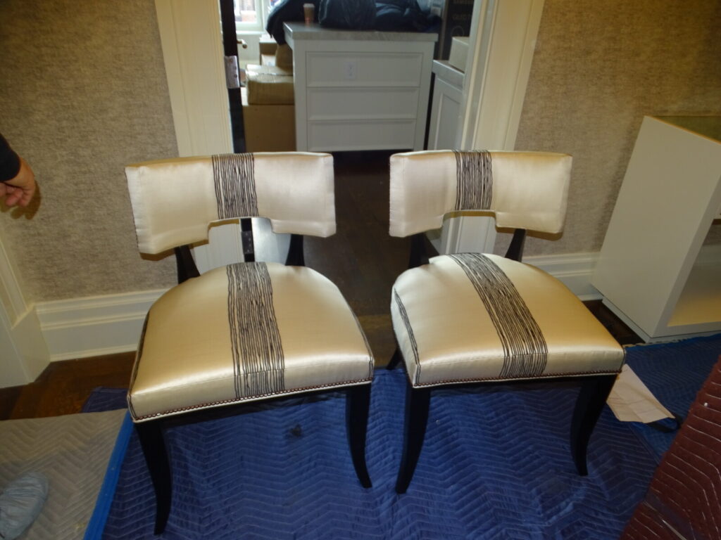 Elegant lounge chair restored and reupholstered, photographed after delivery in a finished interior.