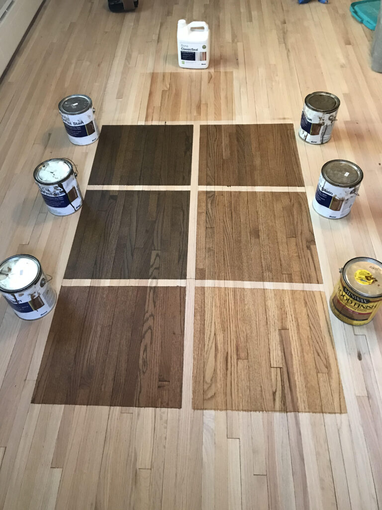 Wood stain color samples displayed on sample boards for refinishing and color‑matching work.
