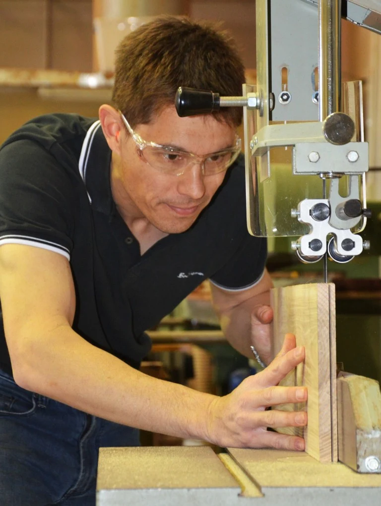 Craftman working on band saw