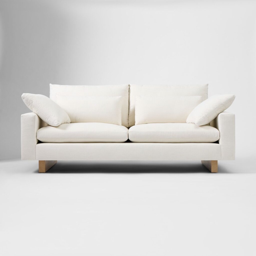 White upholstered sofa shown in a clean, isolated product view against a plain white background.