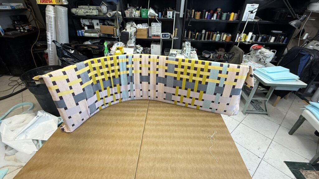 Curved banquette frame assembled on upholstery in the shop.