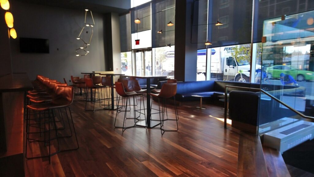 U‑shaped banquette upholstered for a private home movie theater, photographed from the right angle.