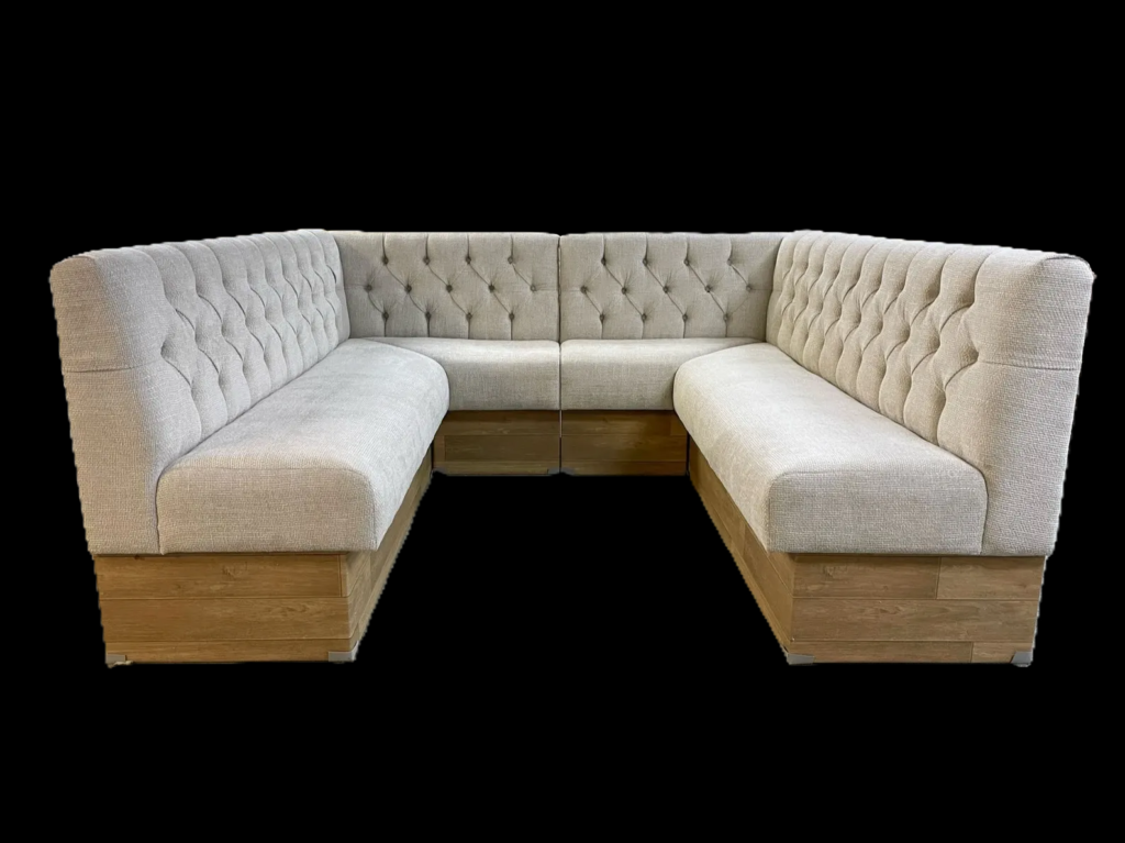 Custom u‑shaped commercial banquette upholstered in a smooth finish shown in an isolated product view against a black background.