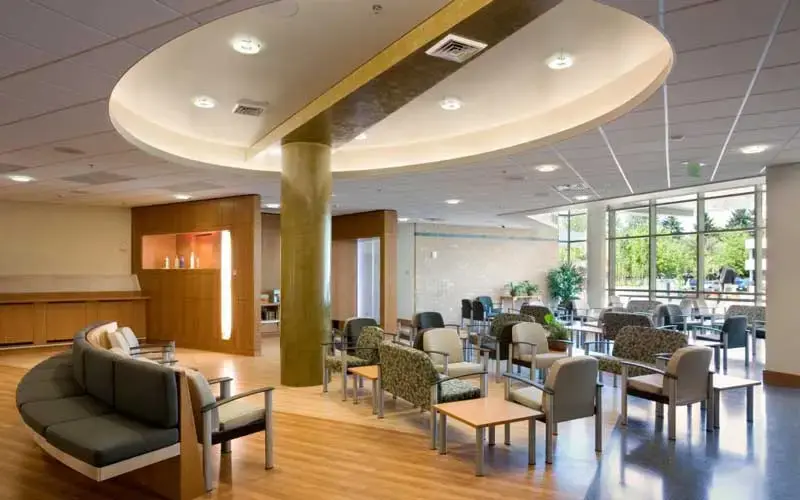 Hotel lobby seating area featuring upholstered chairs and sofas arranged in a clean, welcoming layout.