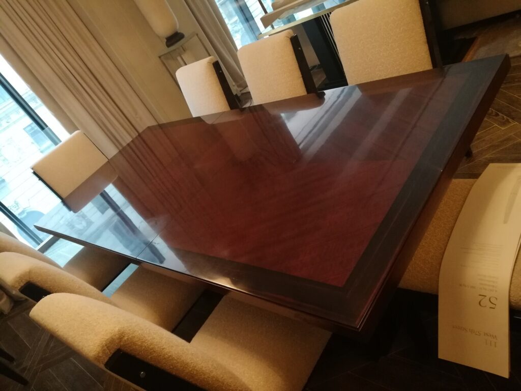 Baker Thomas Pheasant dining table in the client’s home showing surface damage before restoration.
