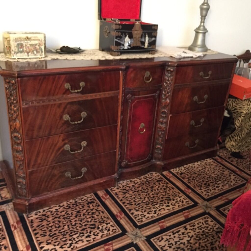 Vintage Baker long dresser in the client’s home showing finish wear and discoloration before restoration.