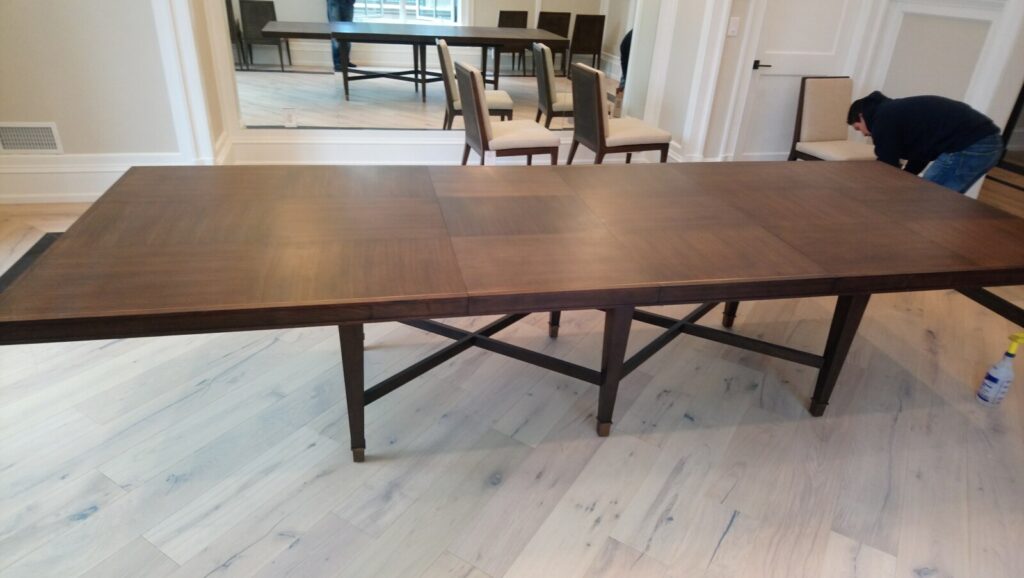 Refinished Barbara Barry for Baker Larchmont extension dining table completed and set in the client’s home after restoration.