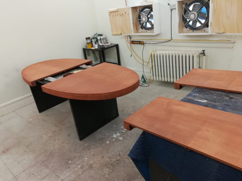 Barbara Barry for Baker oval dining table fully stripped to bare wood in the workshop during the refinishing process.