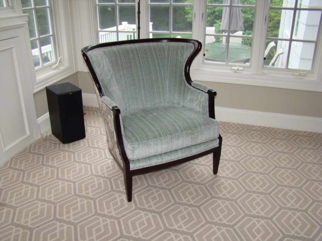 Luxury restoration of a Baker Model 476 chair showcasing artisan frame refinishing and precision upholstery for iconic high-end furniture collections