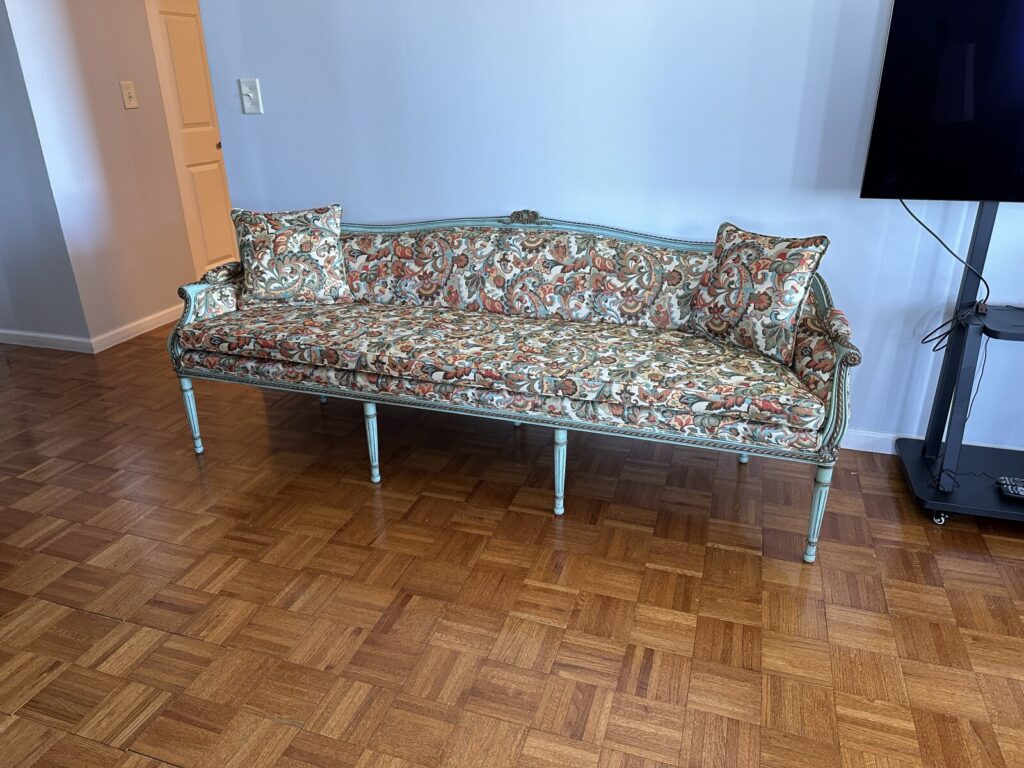 Antique Louis XVI canape sofa fully restored and reupholstered, photographed in the client’s home after refinishing.