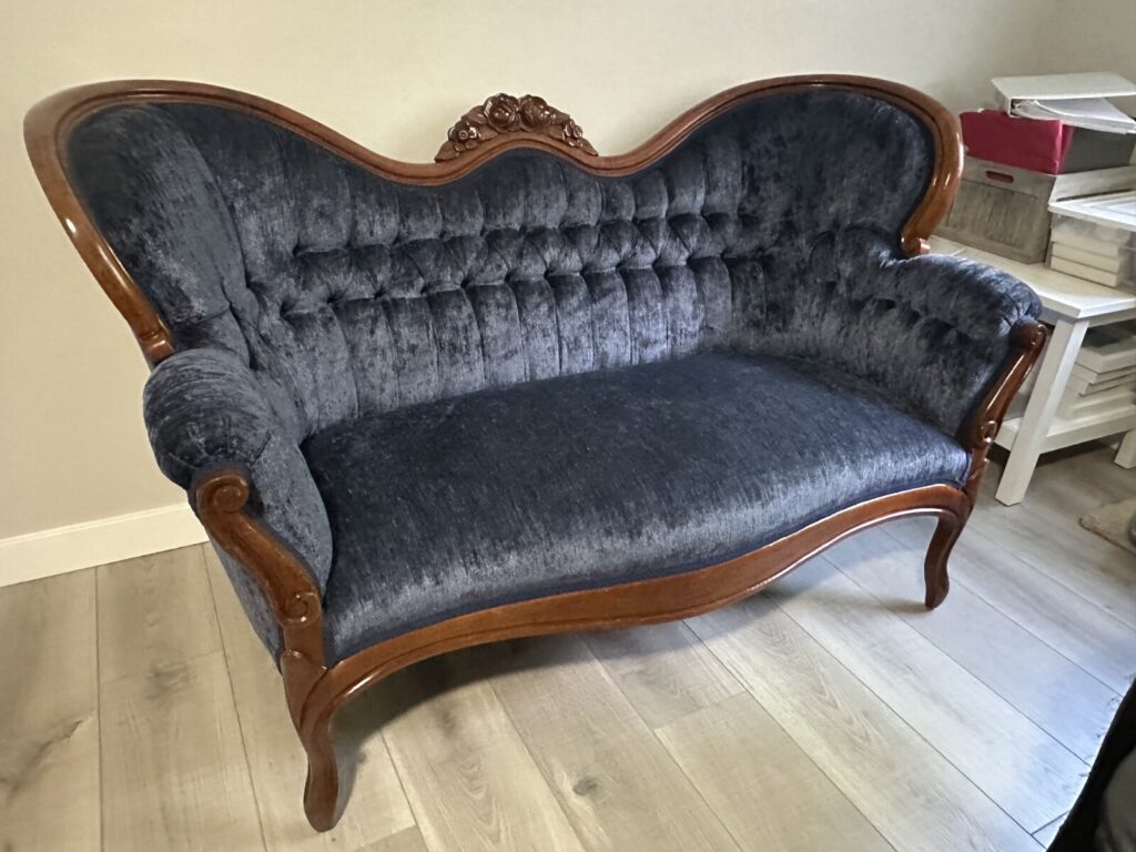 Antique Victorian settee fully restored and photographed in the client’s home after reupholstery.