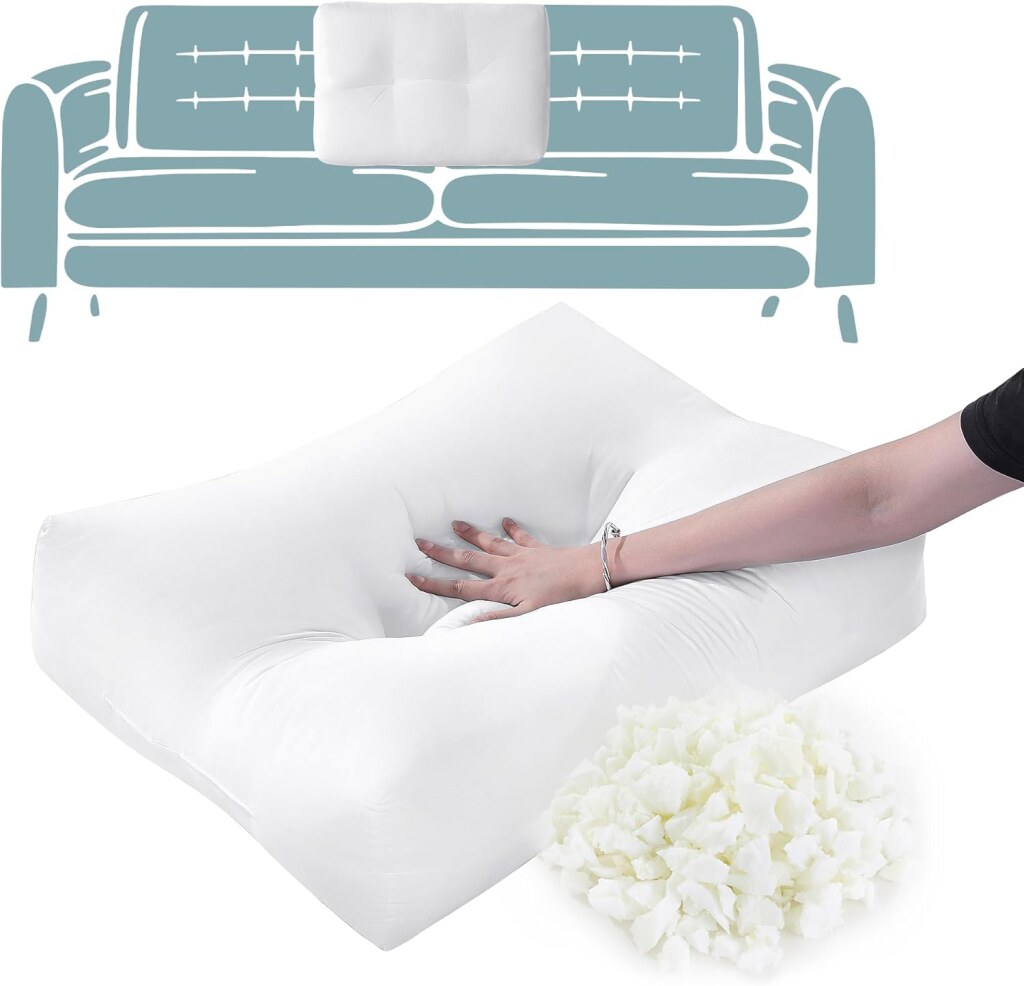 Hand pressing a soft white pillow with shredded foam pieces in the foreground and a simple couch illustration in the background.