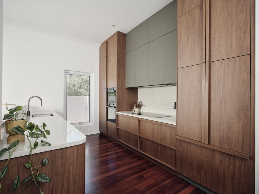 Hallway with vertical wooden paneling and soft lighting