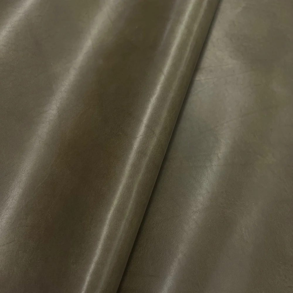 Semianiline leather with light protective coating