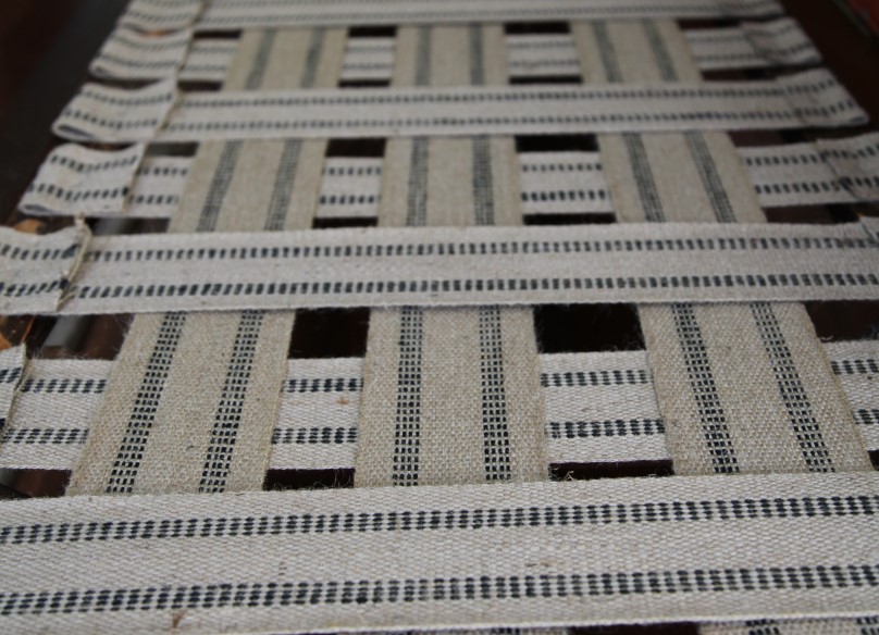 Traditional jute webbing installed for upholstery seat support