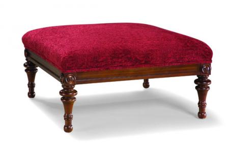 Ottoman being reupholstered with tailored fabric corners