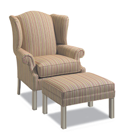 Wingback chair showing curved wings and detailed reupholstery work