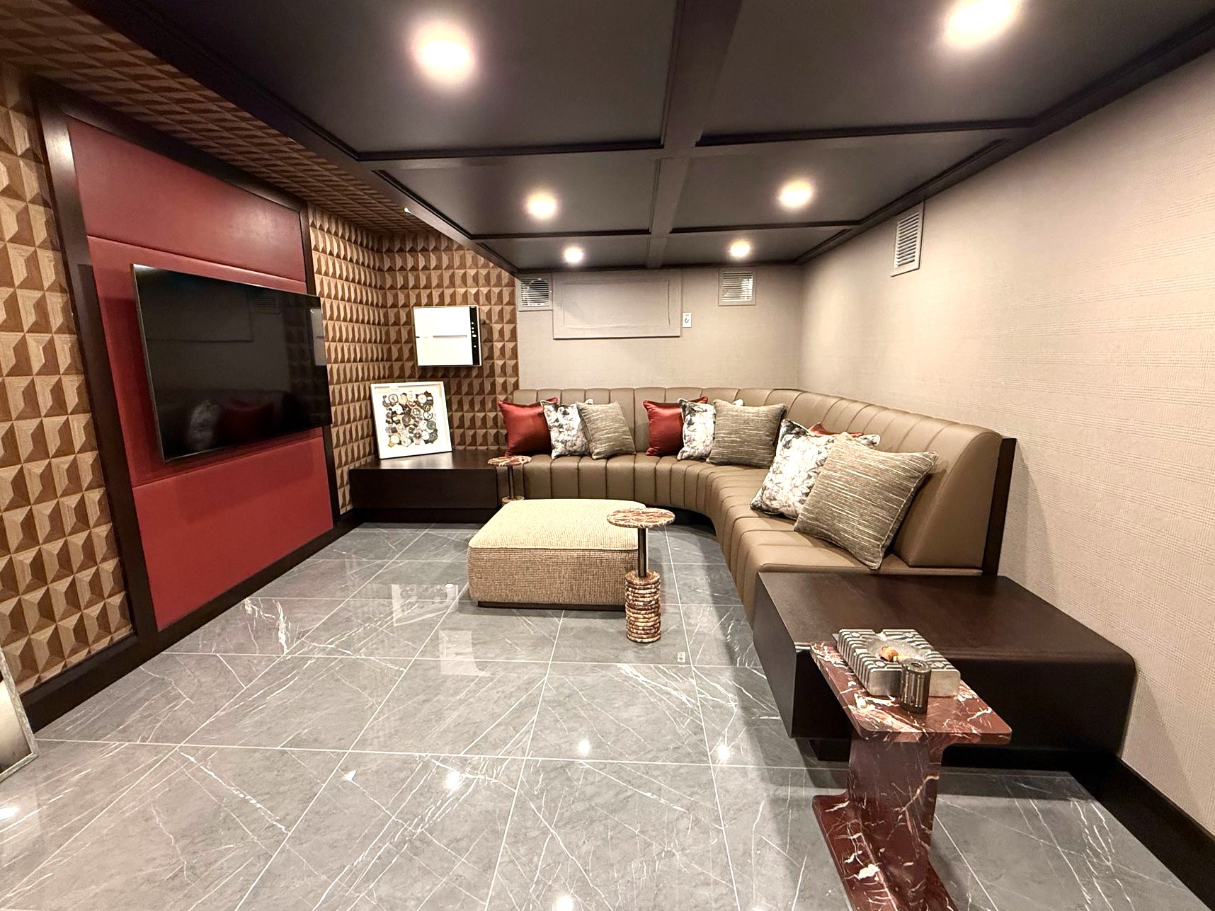 Custom channeltufted home theater banquette seating and upholstered acoustic wall panels fabricated and installed by first class mastercraft.
