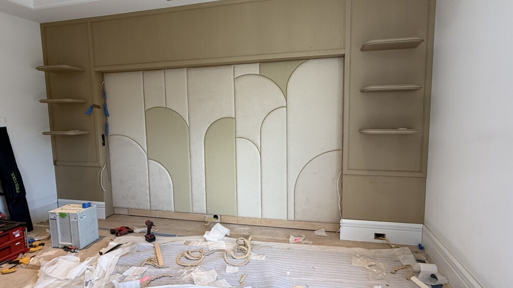 Cnc‑cut geometric wall panel components with precise patterns.