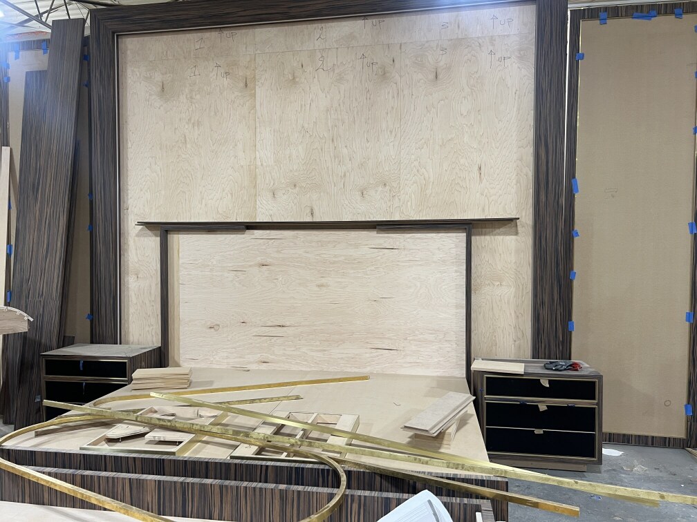 Routed wall panel substrates prepared for upholstery.